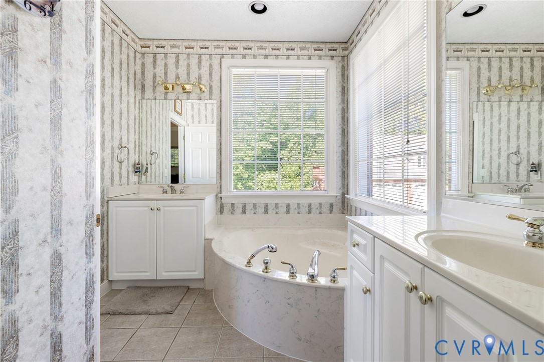 15441 Goshen Road Montpelier, VA 23192 - Photo 26 of 47 a bathroom with bathtub next to a window