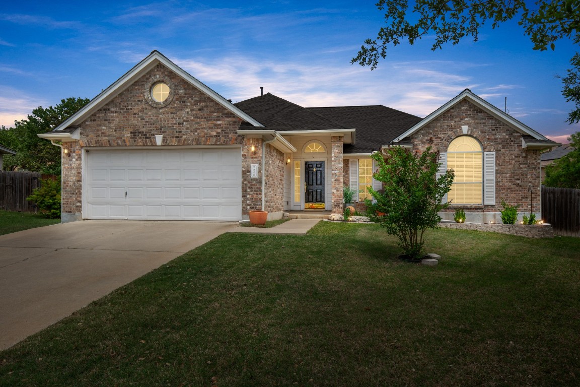 808 Spring Brook Lane Leander, TX 78641 - Photo 1 of 1 a front view of a house with a yard