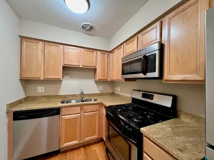 a kitchen with a stove and a microwave
