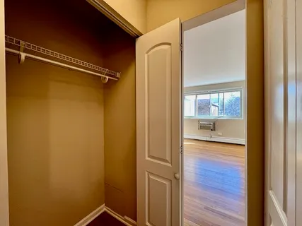 a view of a bathroom from a hallway