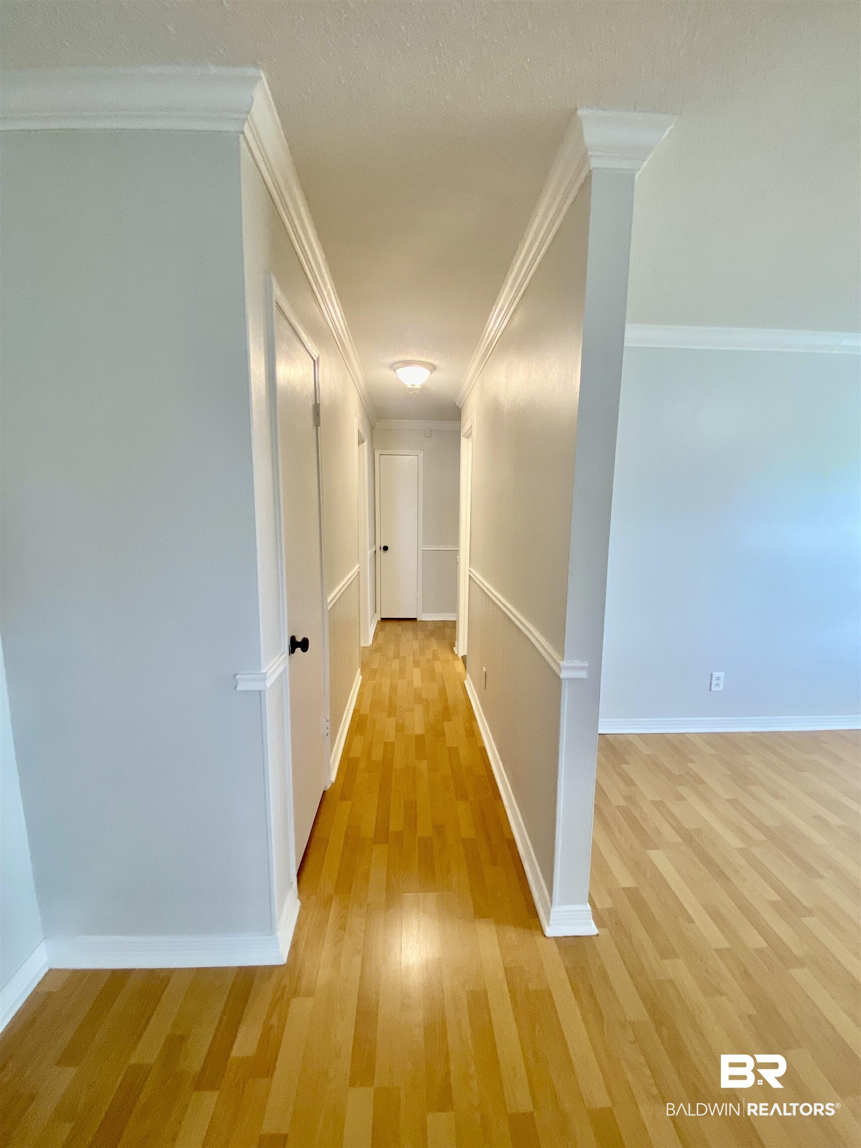 265 Azalea Drive Monroeville, AL 36460 - Photo 20 of 39 Hallway featuring ornamental molding and light wood-type flooring