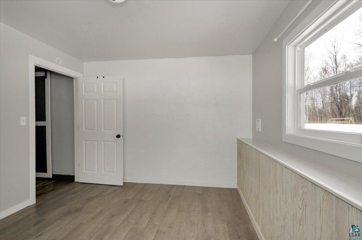 1146 Two Harbors Road Two Harbors, MN 55616 - Photo 22 of 39 Unfurnished room featuring light wood-type flooring and baseboards