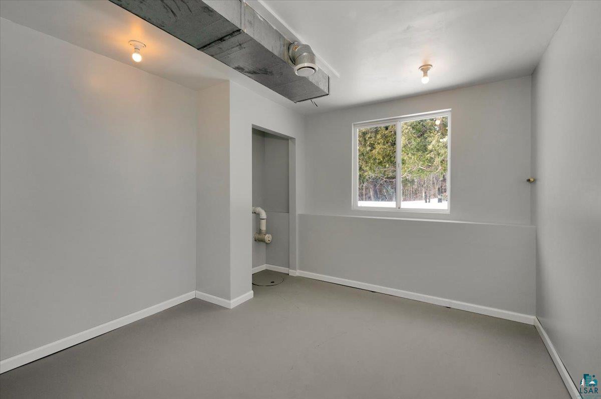 1146 Two Harbors Road Two Harbors, MN 55616 - Photo 24 of 39 Empty room with finished concrete floors and baseboards