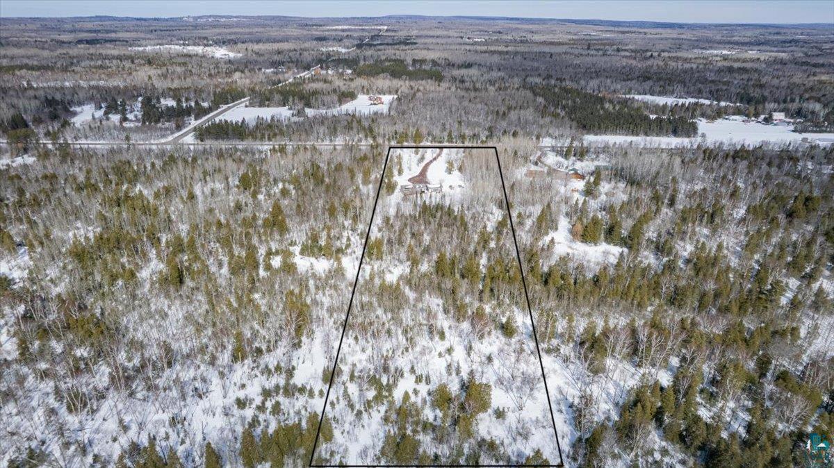 1146 Two Harbors Road Two Harbors, MN 55616 - Photo 35 of 39 Aerial view of property and surrounding area with property parcel outlined and a forest