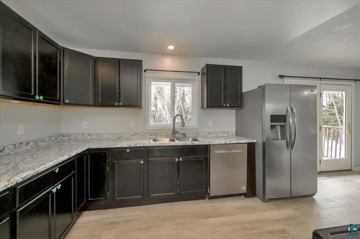 1146 Two Harbors Road Two Harbors, MN 55616 - Photo 7 of 39 Kitchen with stainless steel appliances, light wood-style floors, and recessed lighting