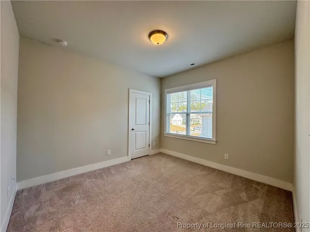 a white toilet sitting next to a bath tub and a shower