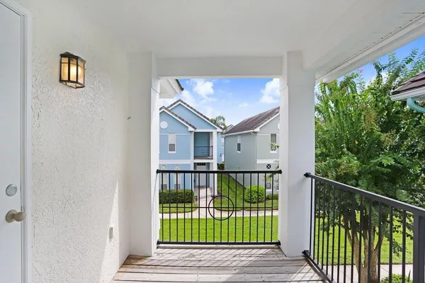 a view of a house with a small yard