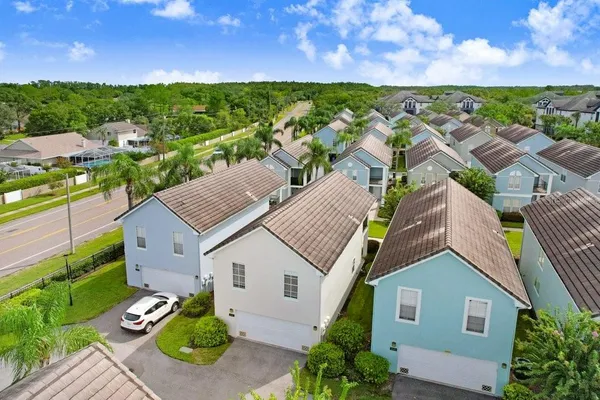 a aerial view of multiple houses with a yard