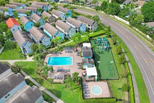 an aerial view of a house with a garden and trees