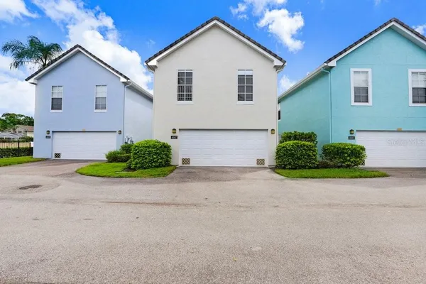 a view of a house with a yard and garage