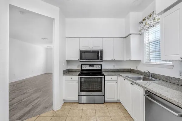 a kitchen with a stove and a sink