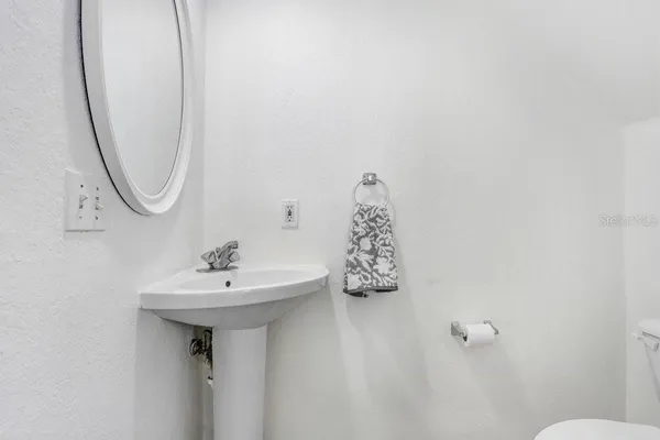 a bathroom with a sink and mirror