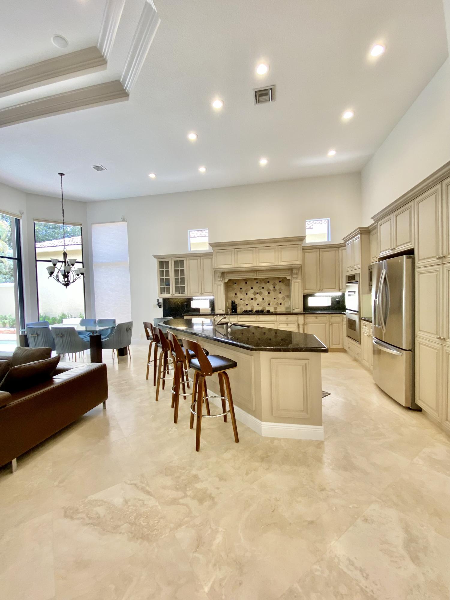 17754 Lake Azure Way Boca Raton, FL 33496 - Photo 11 of 30 a large kitchen with lots of counter space furniture and a refrigerator