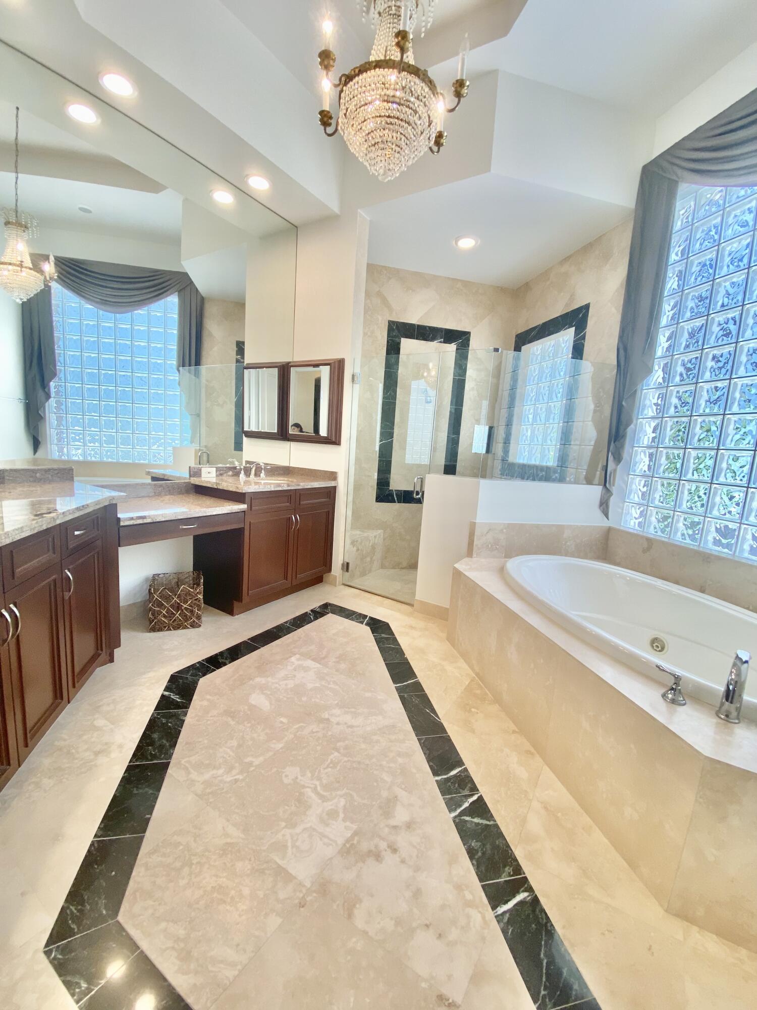 17754 Lake Azure Way Boca Raton, FL 33496 - Photo 20 of 30 a large spacious bathroom with a large tub and sink