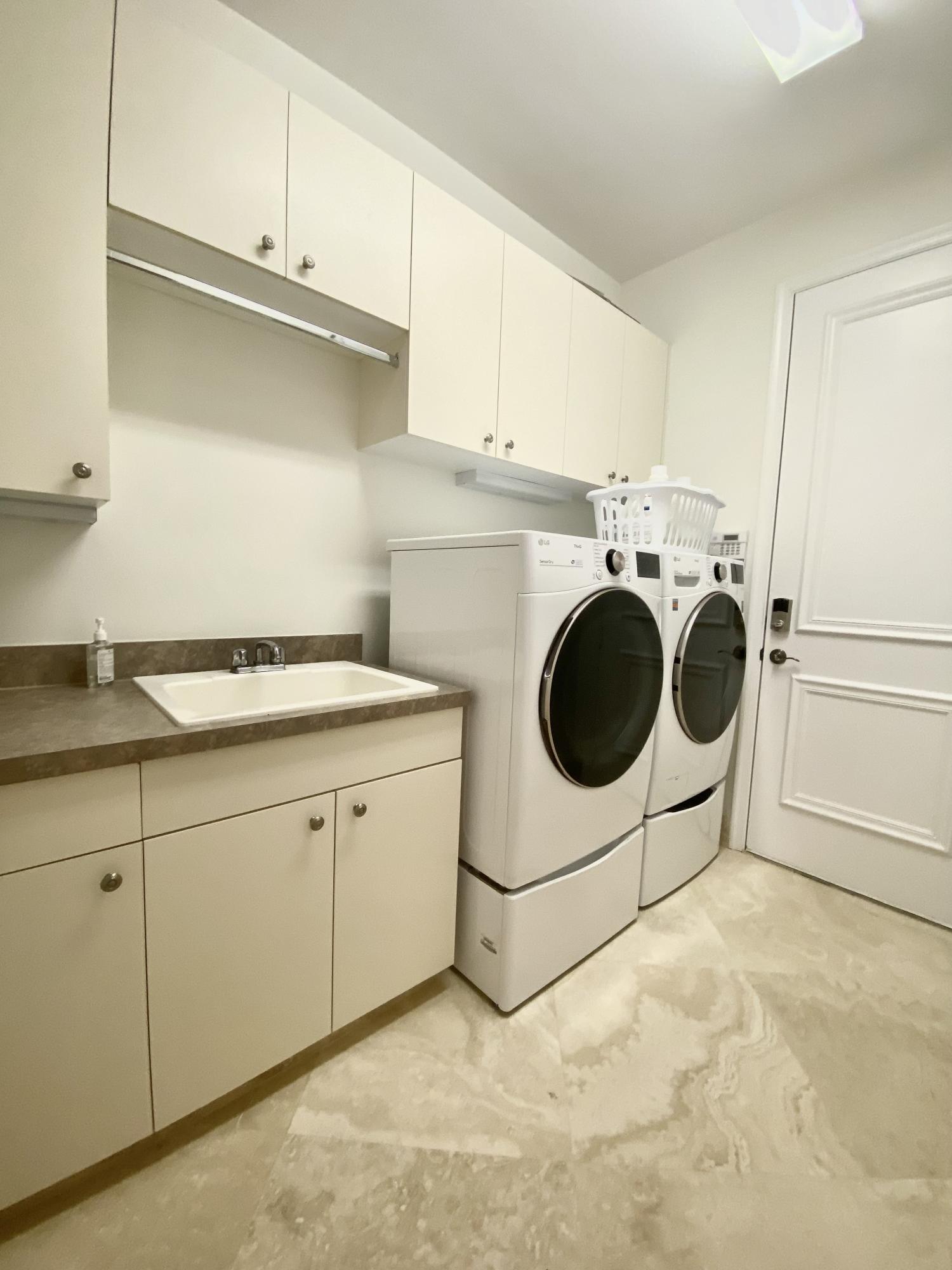 17754 Lake Azure Way Boca Raton, FL 33496 - Photo 24 of 30 a utility room with sink dryer and washer