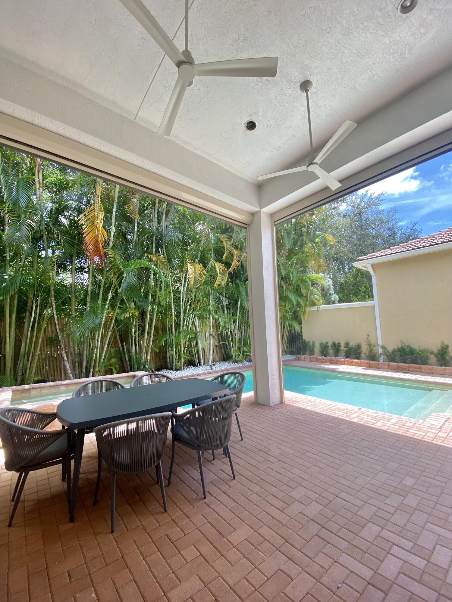 17754 Lake Azure Way Boca Raton, FL 33496 - Photo 25 of 30 a view of a dining room with furniture window and outside view