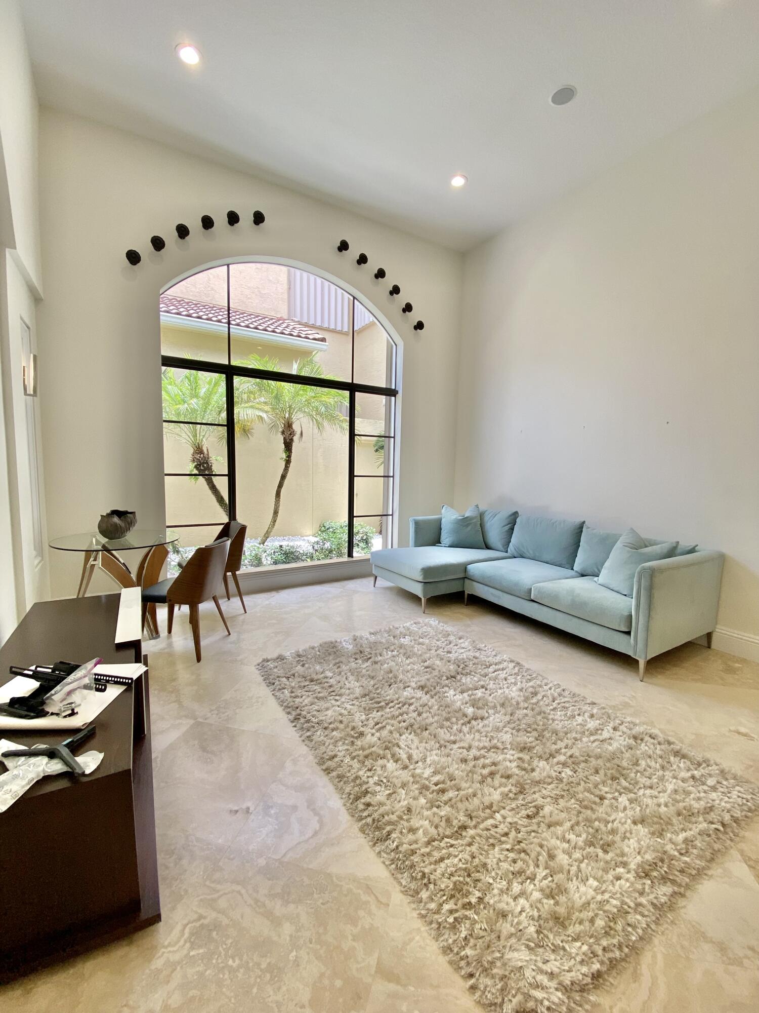 17754 Lake Azure Way Boca Raton, FL 33496 - Photo 5 of 30 a living room with furniture and a large window