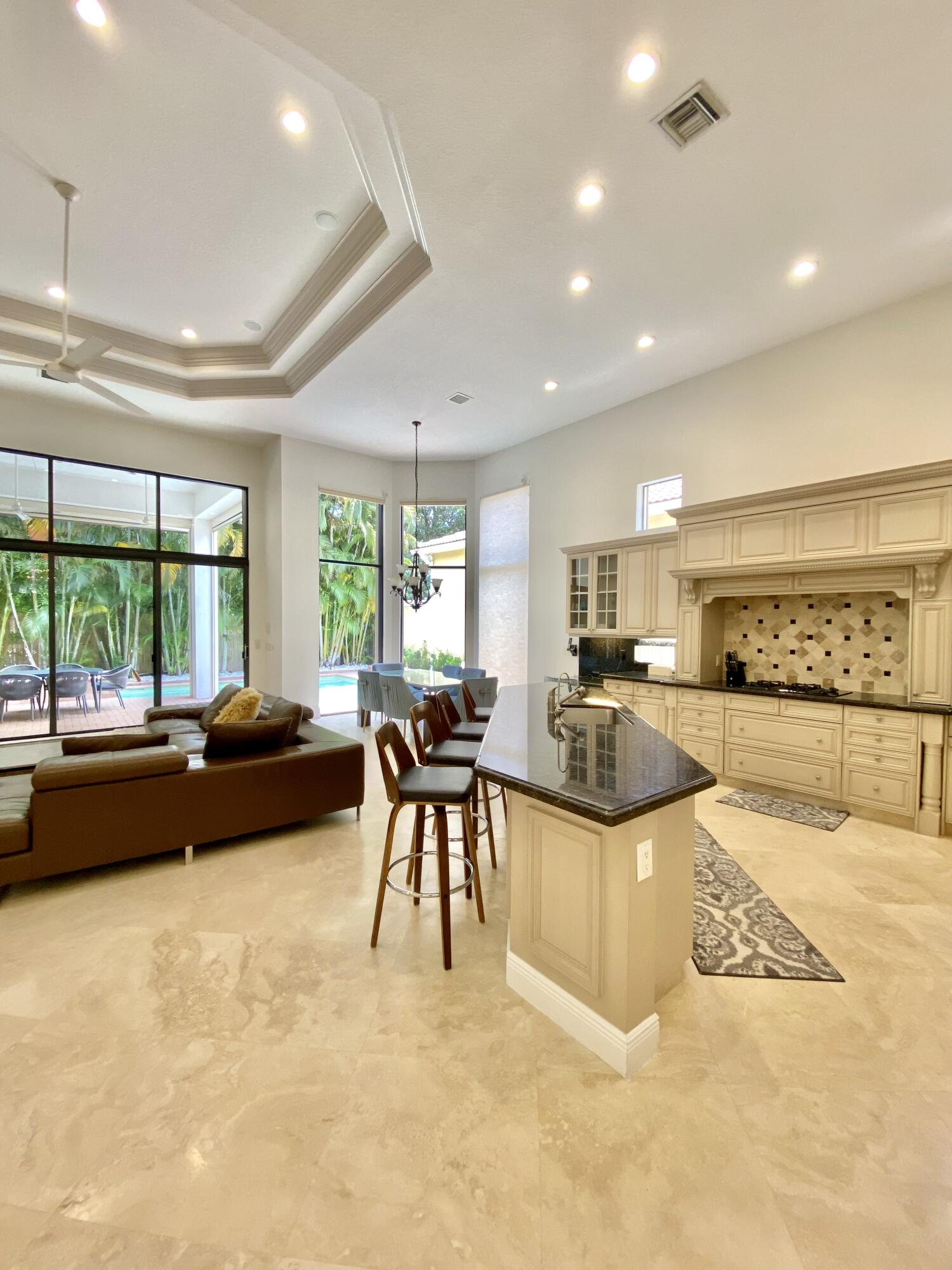 17754 Lake Azure Way Boca Raton, FL 33496 - Photo 10 of 30 a living room with furniture a large window and a table