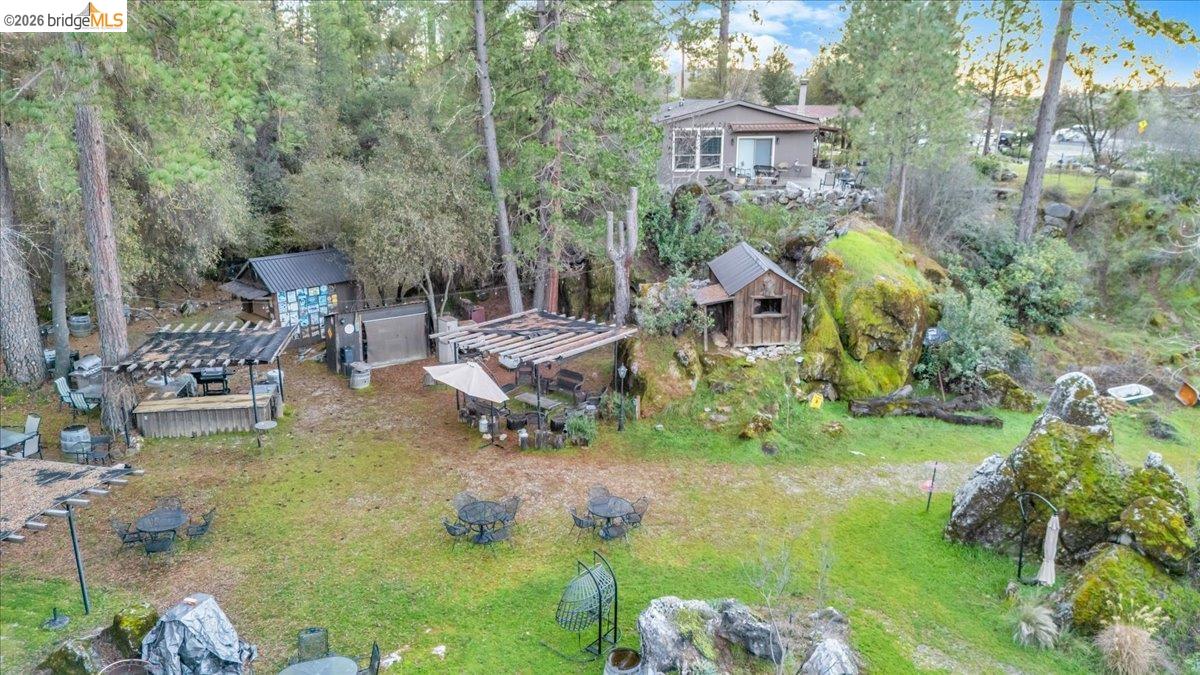 22389 Parrotts Ferry Road Columbia, CA 95310 - Photo 12 of 60 a view of backyard with outdoor seating and green space