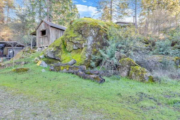 a backyard of a house with lots of green space