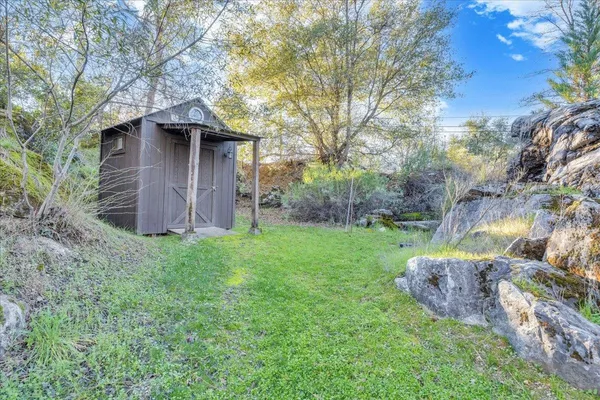a backyard of a house with lots of green space