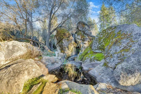 a view of a fire pit in a backyard