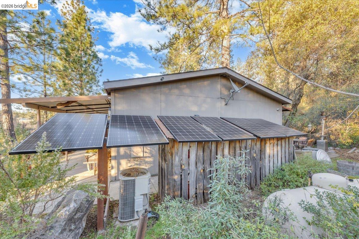 22389 Parrotts Ferry Road Columbia, CA 95310 - Photo 26 of 60 a front view of a house with a yard