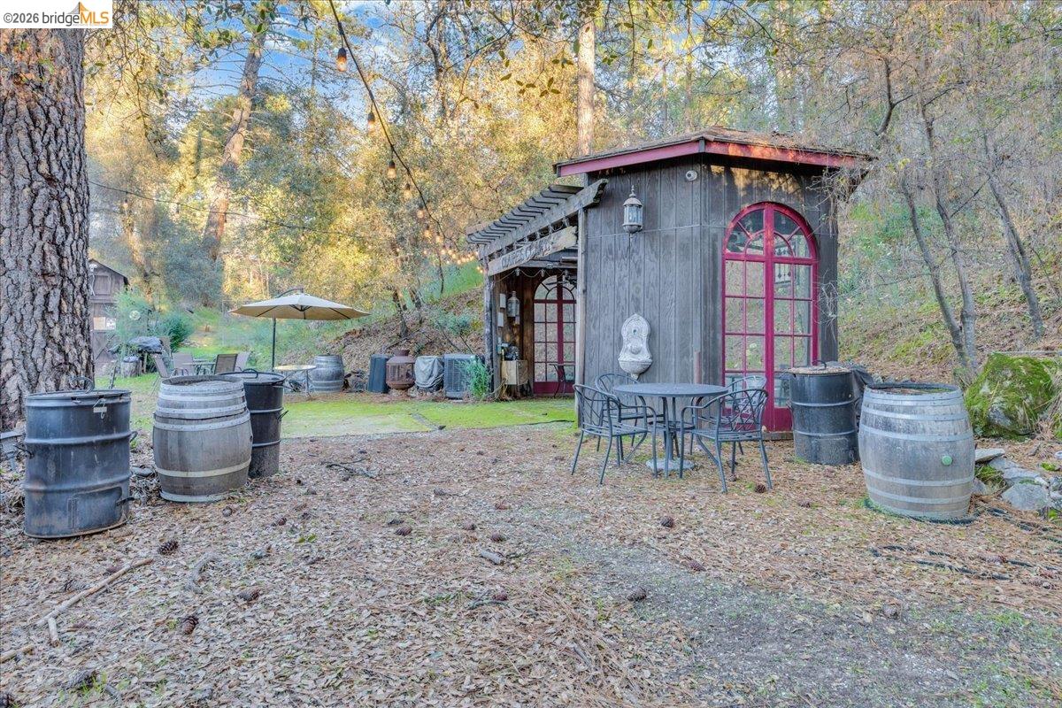 22389 Parrotts Ferry Road Columbia, CA 95310 - Photo 32 of 60 View of yard with an outbuilding