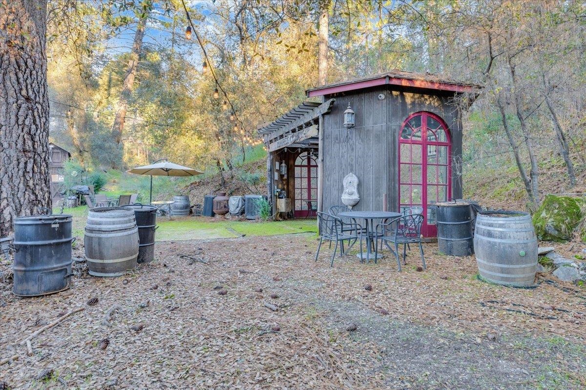 22389 Parrotts Ferry Road Columbia, CA 95310 - Photo 32 of 60 View of yard with an outbuilding