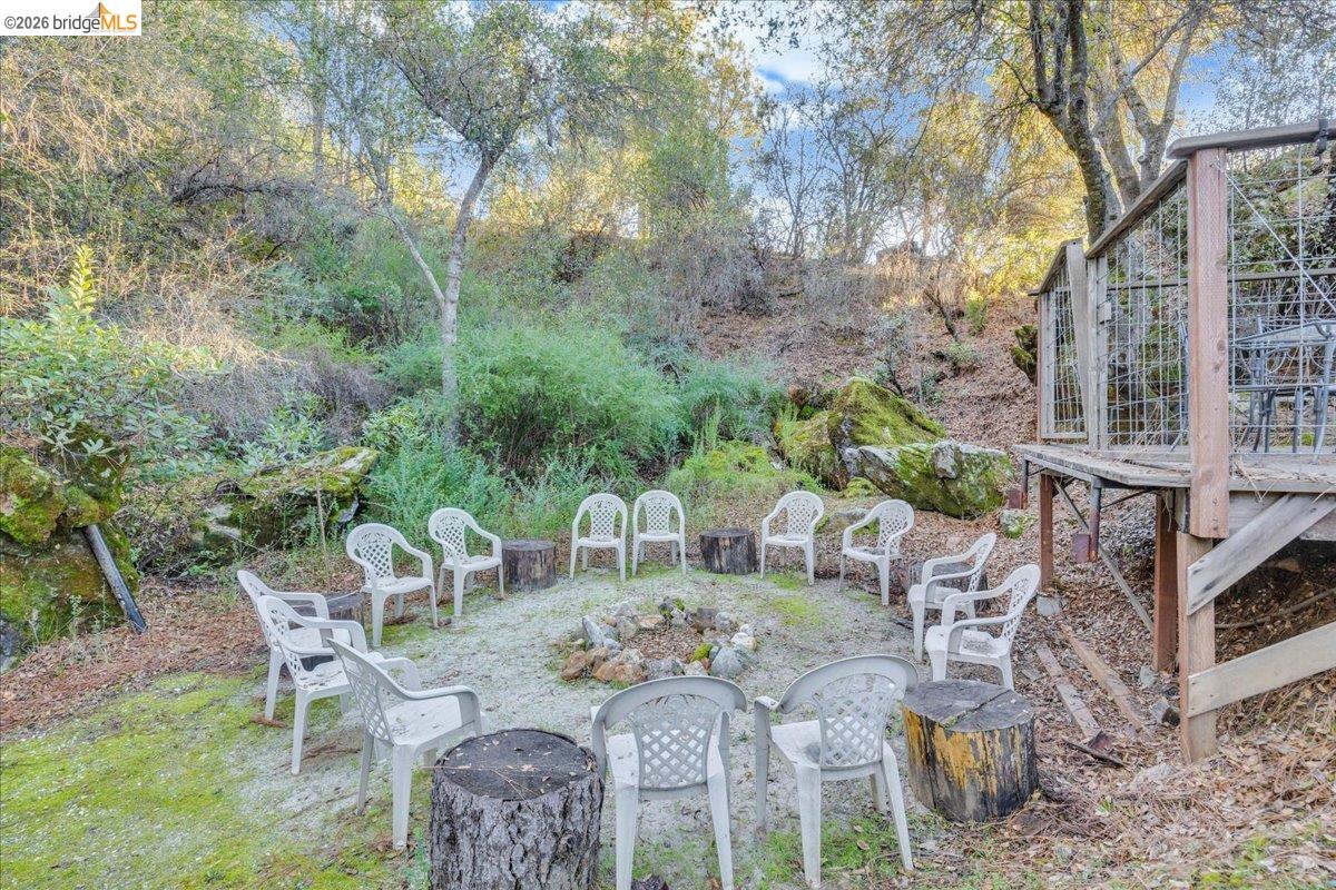22389 Parrotts Ferry Road Columbia, CA 95310 - Photo 33 of 60 a view of a chairs and table in patio