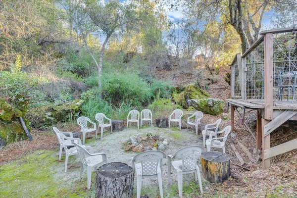a view of a dining room with furniture and a chandelier