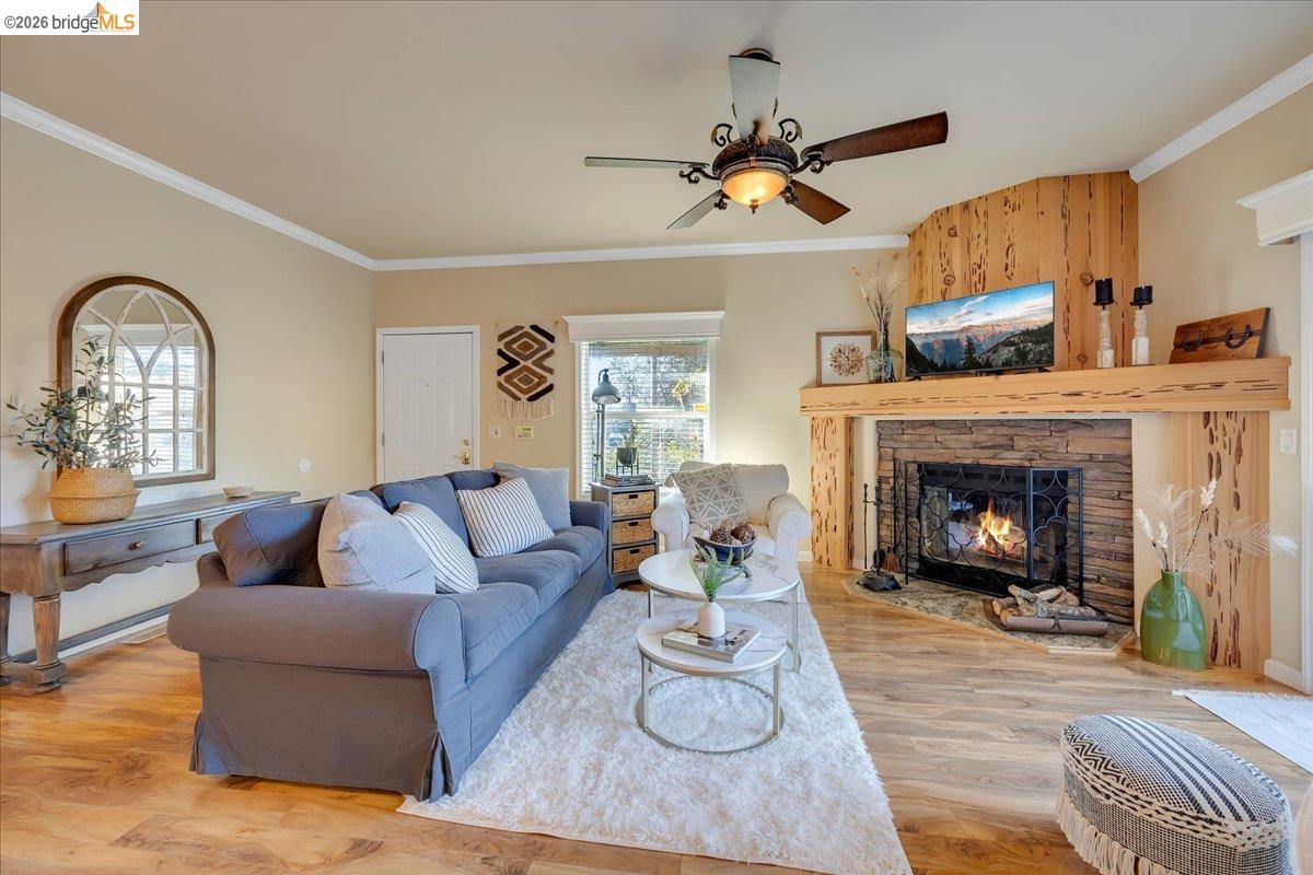 22389 Parrotts Ferry Road Columbia, CA 95310 - Photo 36 of 60 a living room with furniture and a fireplace
