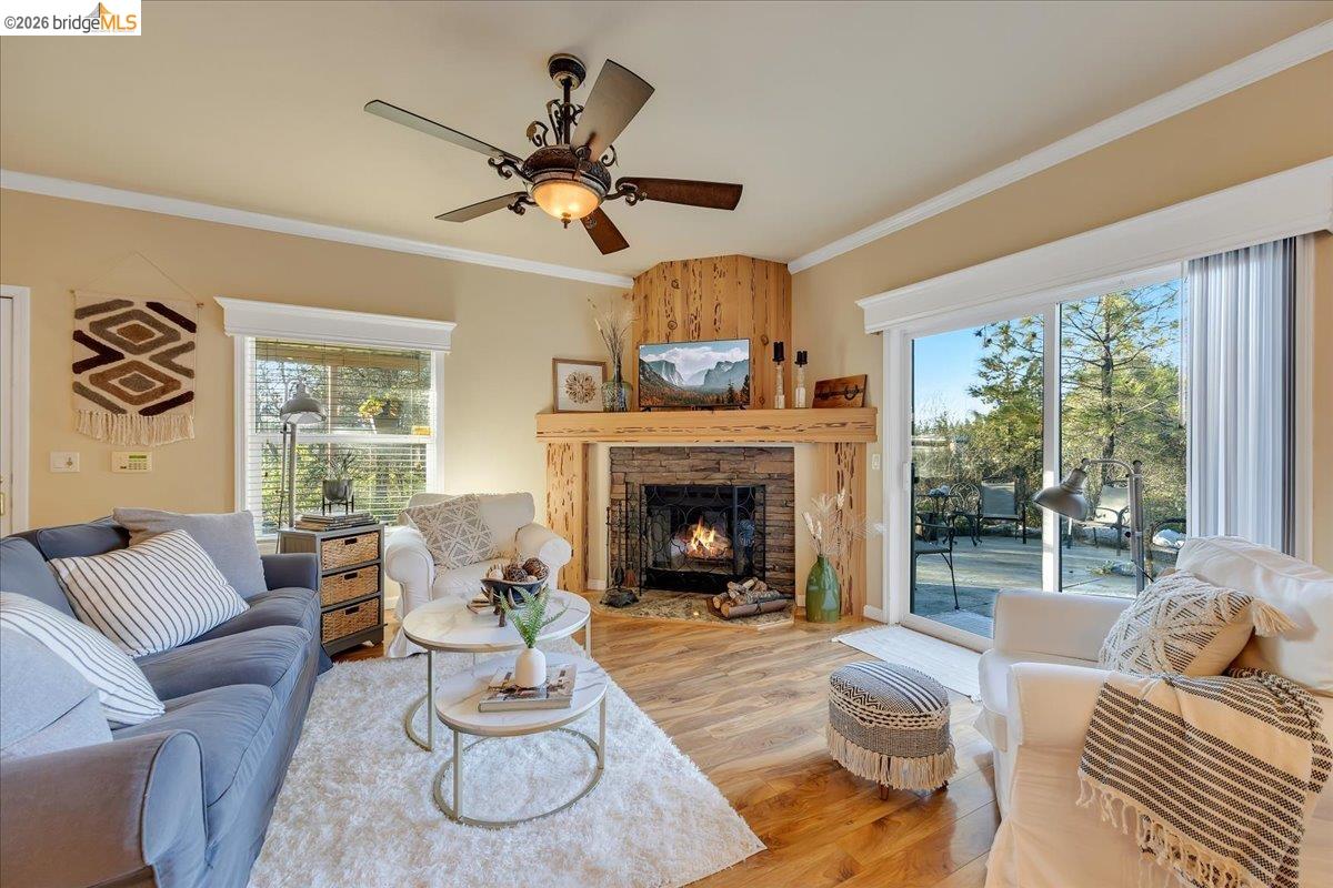 22389 Parrotts Ferry Road Columbia, CA 95310 - Photo 37 of 60 a living room with furniture fireplace and a large window