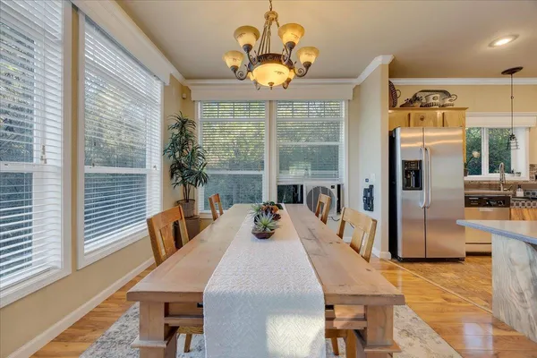 a view of a dining room with furniture window and outside view