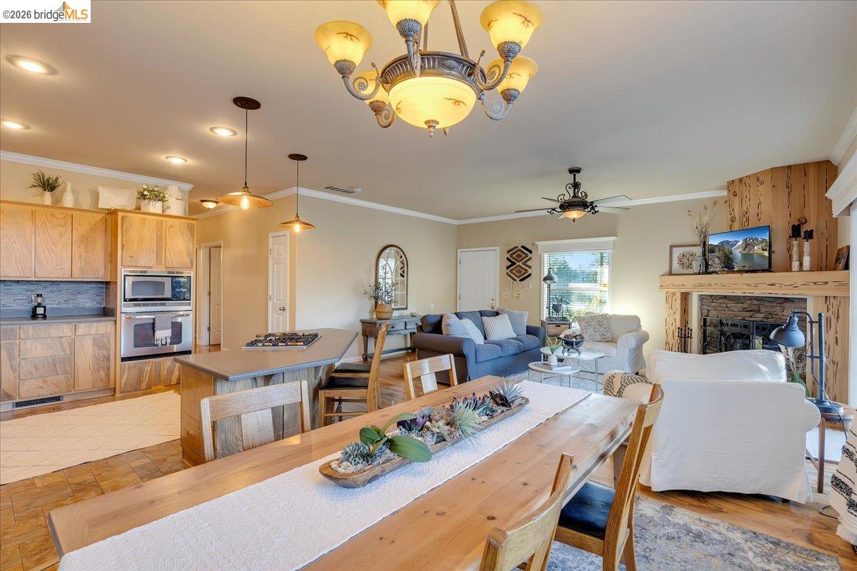 22389 Parrotts Ferry Road Columbia, CA 95310 - Photo 42 of 60 a living room with fireplace furniture and a chandelier