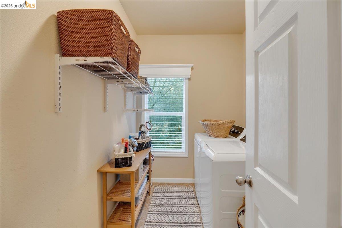 22389 Parrotts Ferry Road Columbia, CA 95310 - Photo 50 of 60 Washroom with separate washer and dryer and baseboards