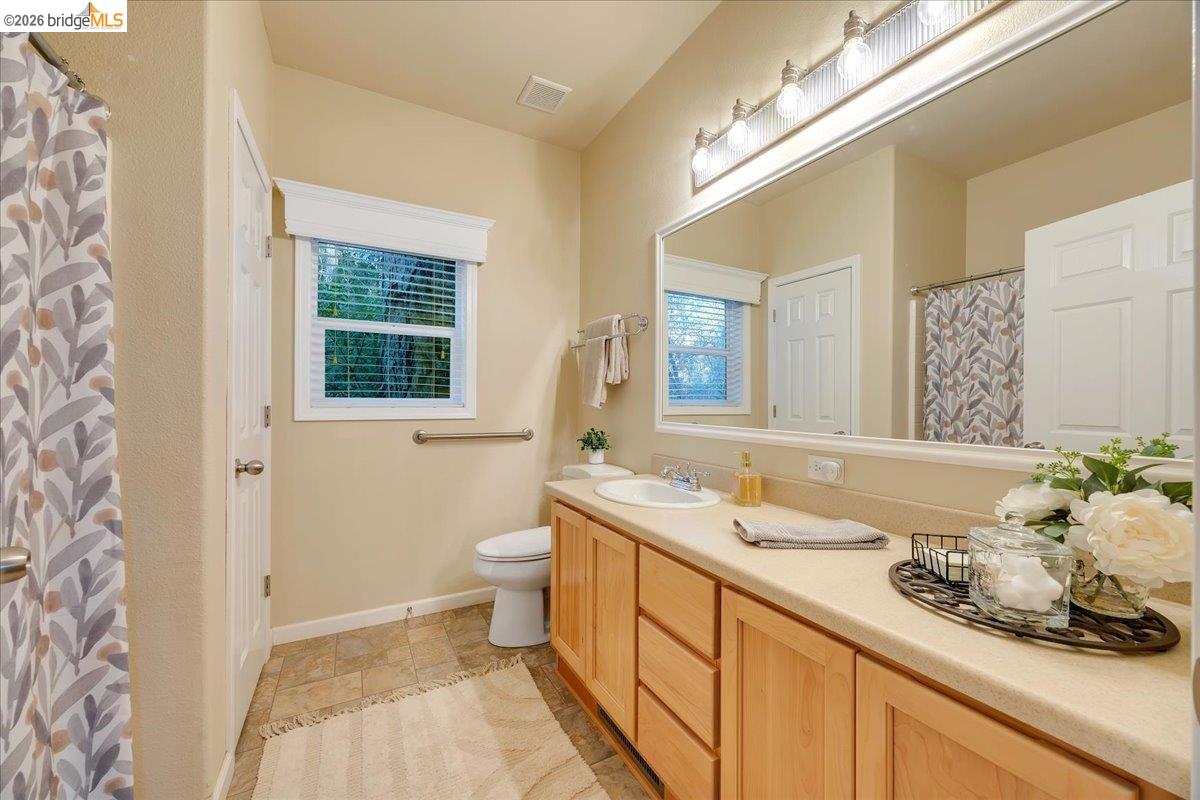 22389 Parrotts Ferry Road Columbia, CA 95310 - Photo 53 of 60 a bathroom with a sink and a mirror