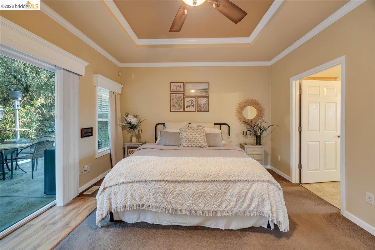 22389 Parrotts Ferry Road Columbia, CA 95310 - Photo 54 of 60 a spacious bedroom with a bed and a window