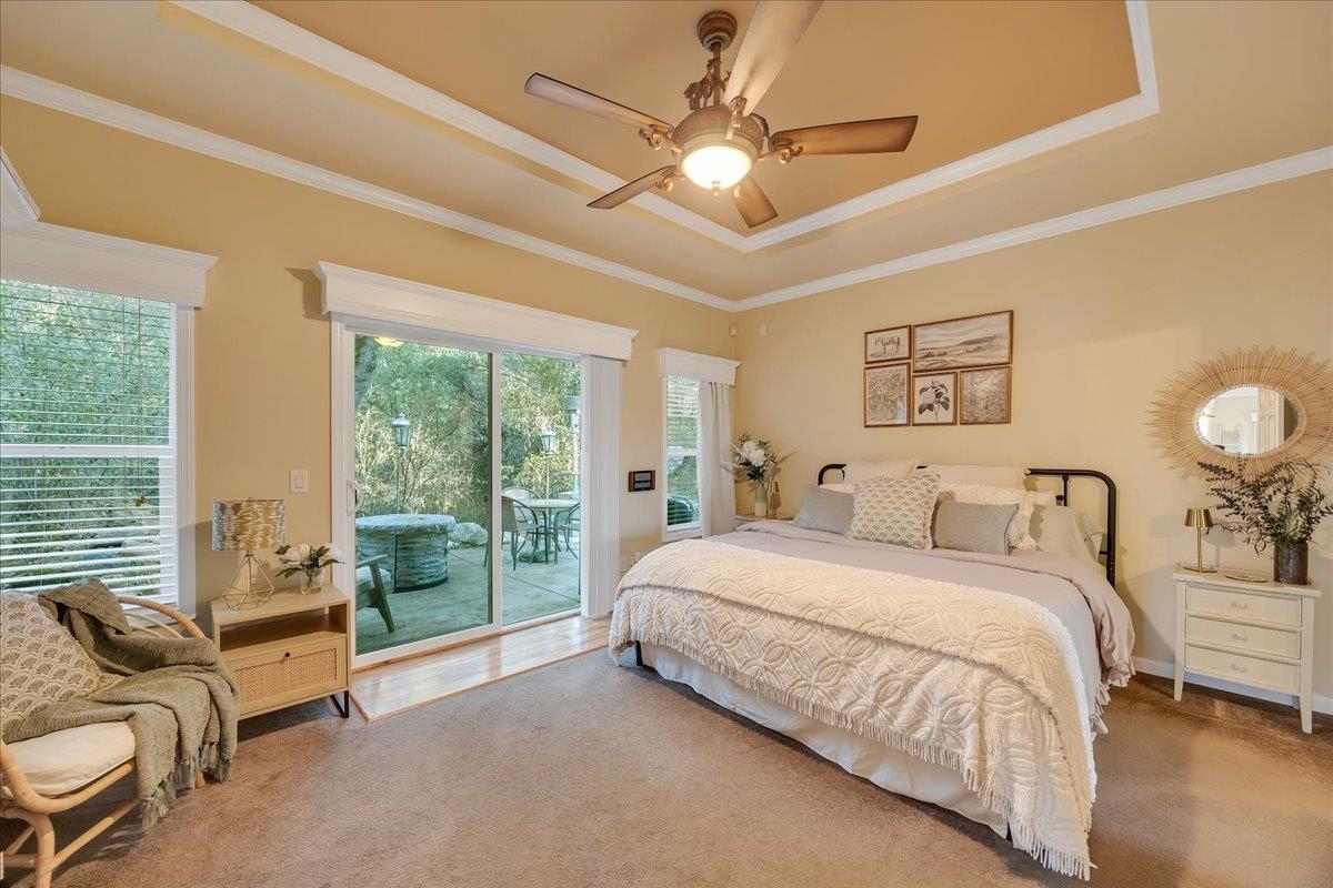 22389 Parrotts Ferry Road Columbia, CA 95310 - Photo 55 of 60 Bedroom featuring a ceiling fan, access to exterior, a tray ceiling, and crown molding