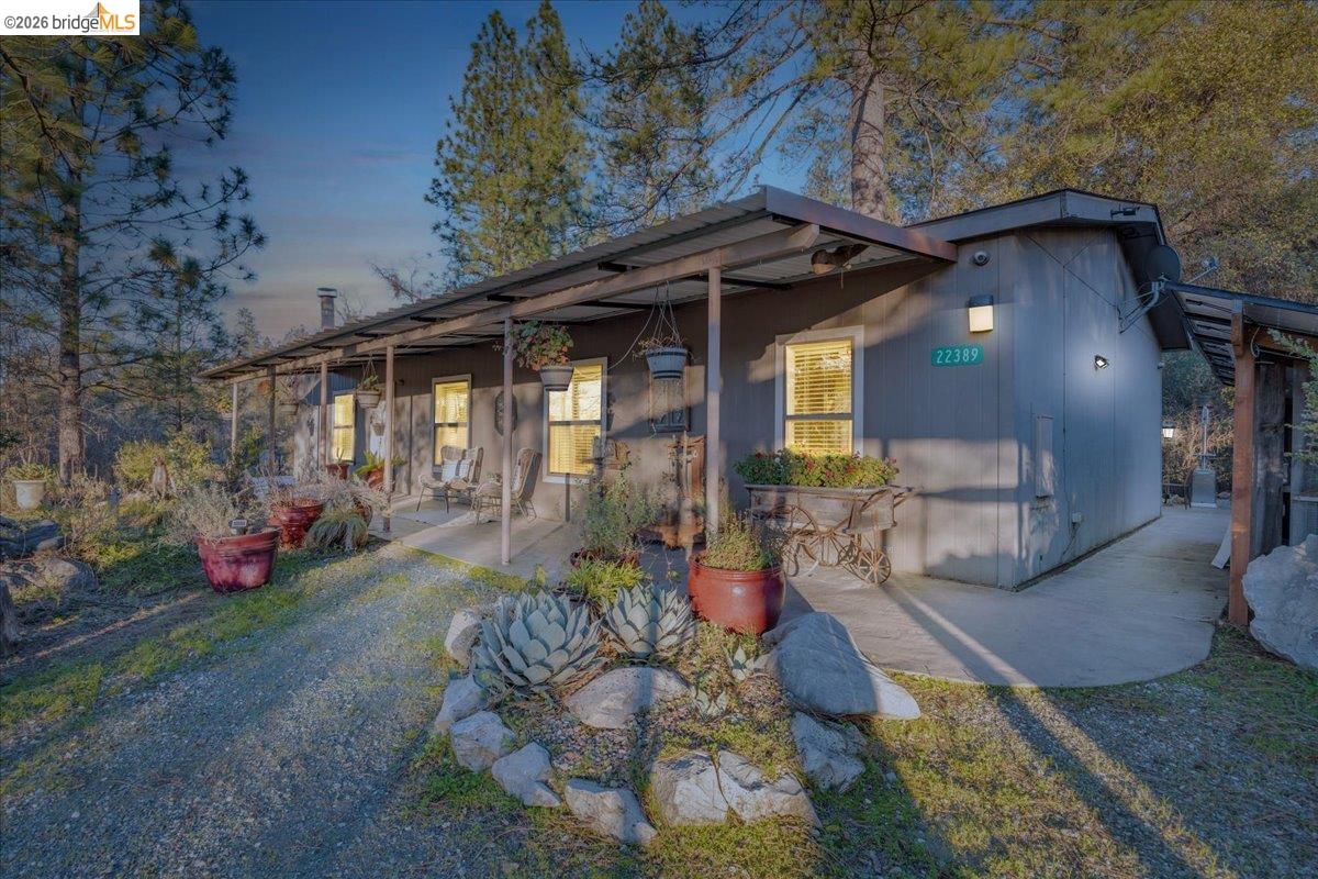 22389 Parrotts Ferry Road Columbia, CA 95310 - Photo 59 of 60 a view of a house with a yard