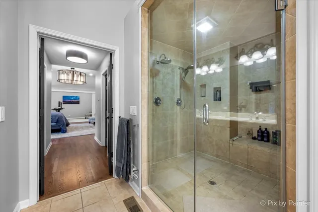 a spacious bedroom with a bed and a table in it