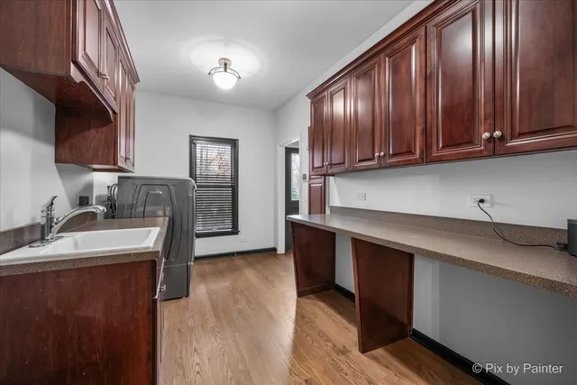 a kitchen with kitchen island a sink counter and chairs