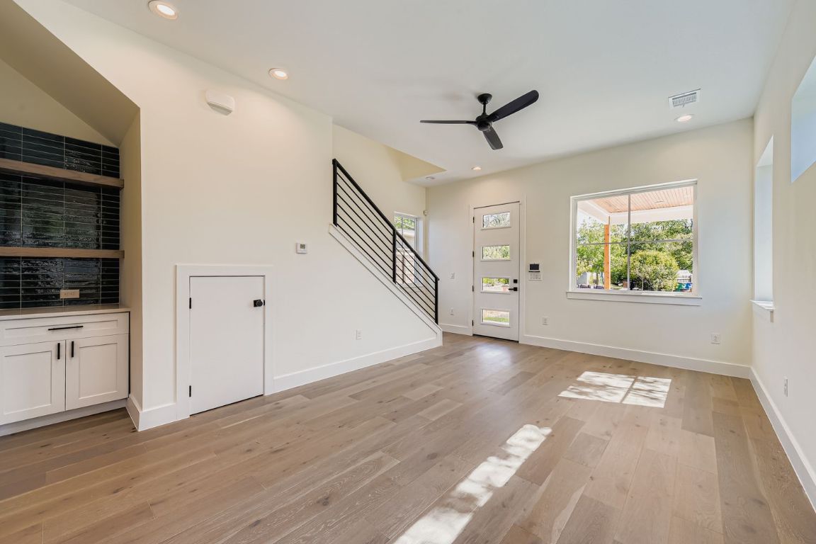 4712 South Forest Drive Austin, TX 78745 - Photo 15 of 27 a view of an empty room with wooden floor and a window