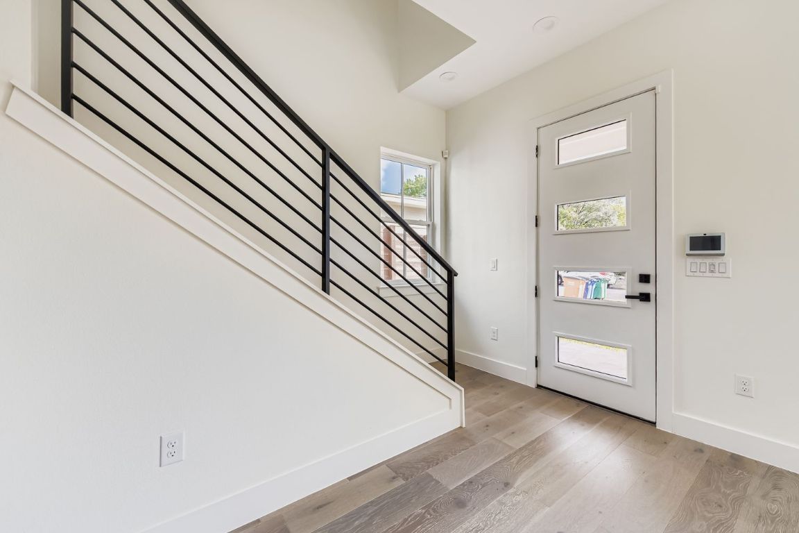 4712 South Forest Drive Austin, TX 78745 - Photo 16 of 27 an entryway in a hall with a window and wooden floor