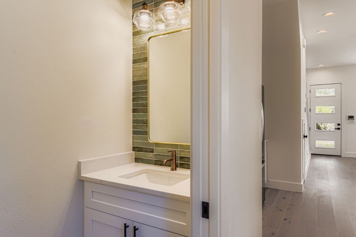 4712 South Forest Drive Austin, TX 78745 - Photo 18 of 27 a bathroom with a sink and a mirror