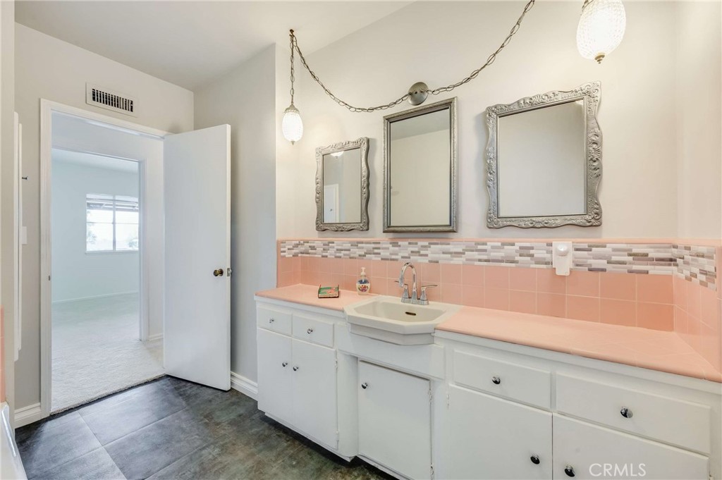 3665 Landfair Road Pasadena, CA 91107 - Photo 23 of 32 a bathroom with a double vanity sink and mirror