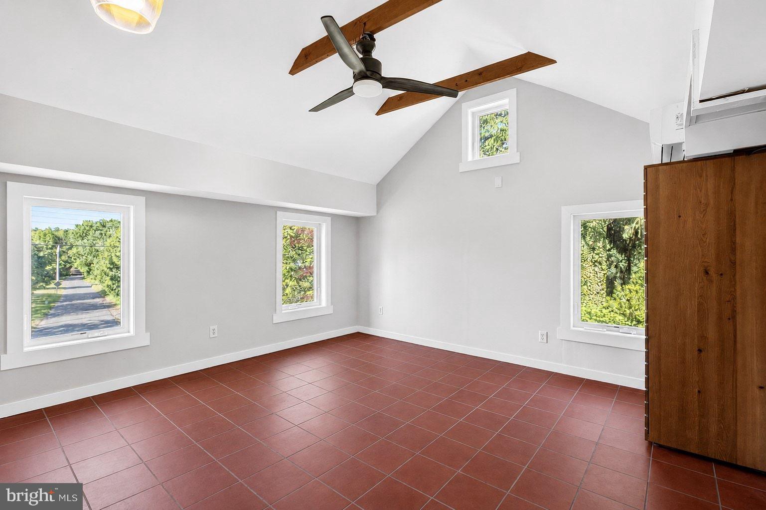 498 Perrineville Road Robbinsville, NJ 08691 - Photo 38 of 59 an empty room with windows and ceiling fan