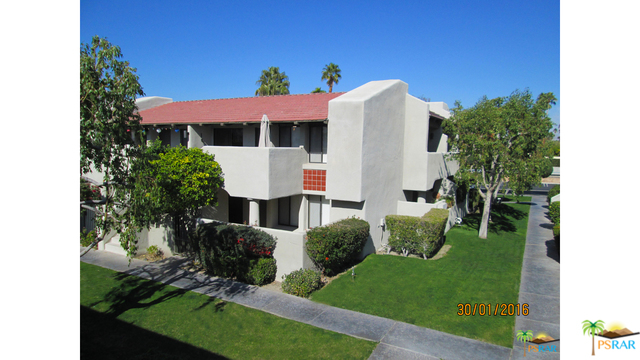 1150 East Amado Road, Unit 18D2 Palm Springs, CA 92262 - Photo 3 of 13 a aerial view of a house with table and chairs