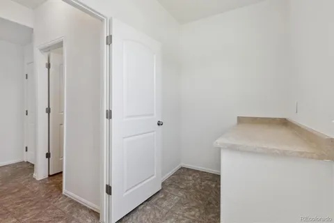 a view of a hallway with white walls