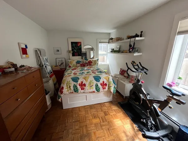 a bedroom with a bed and a tv